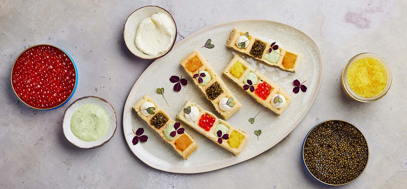 Waffles with caviar and fish eggs 