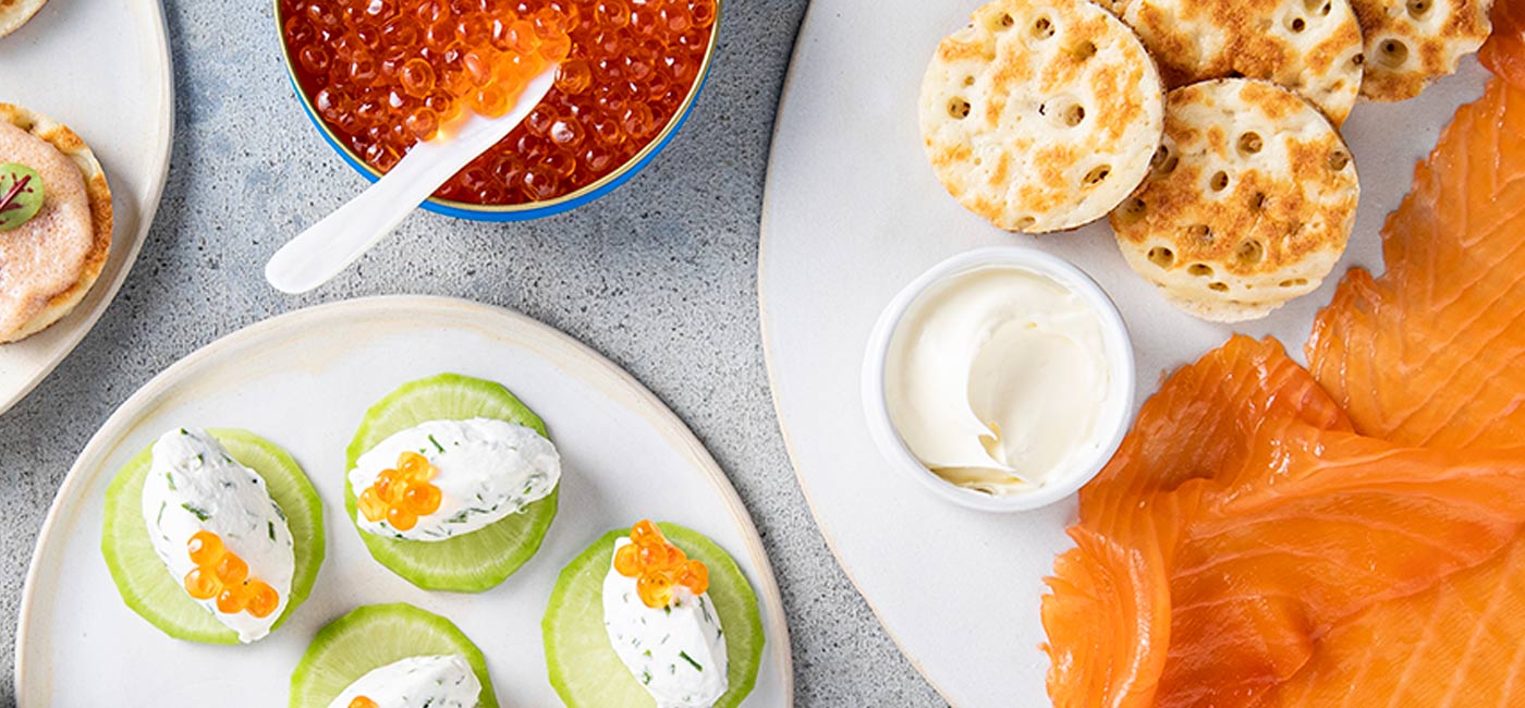 Soft cheese, salmon roe and cucumber canapés