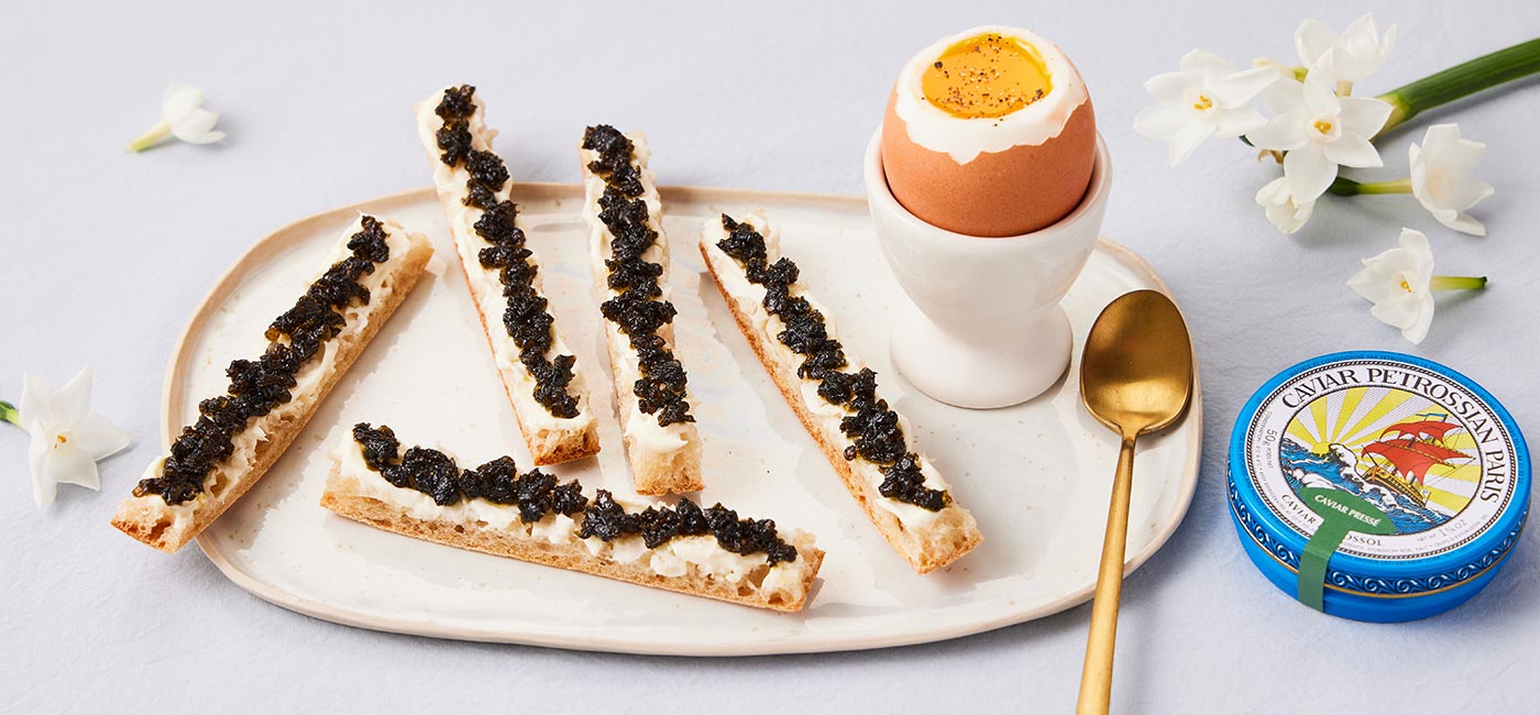 Boiled eggs and bread fingers with 1835 Pressed Caviar